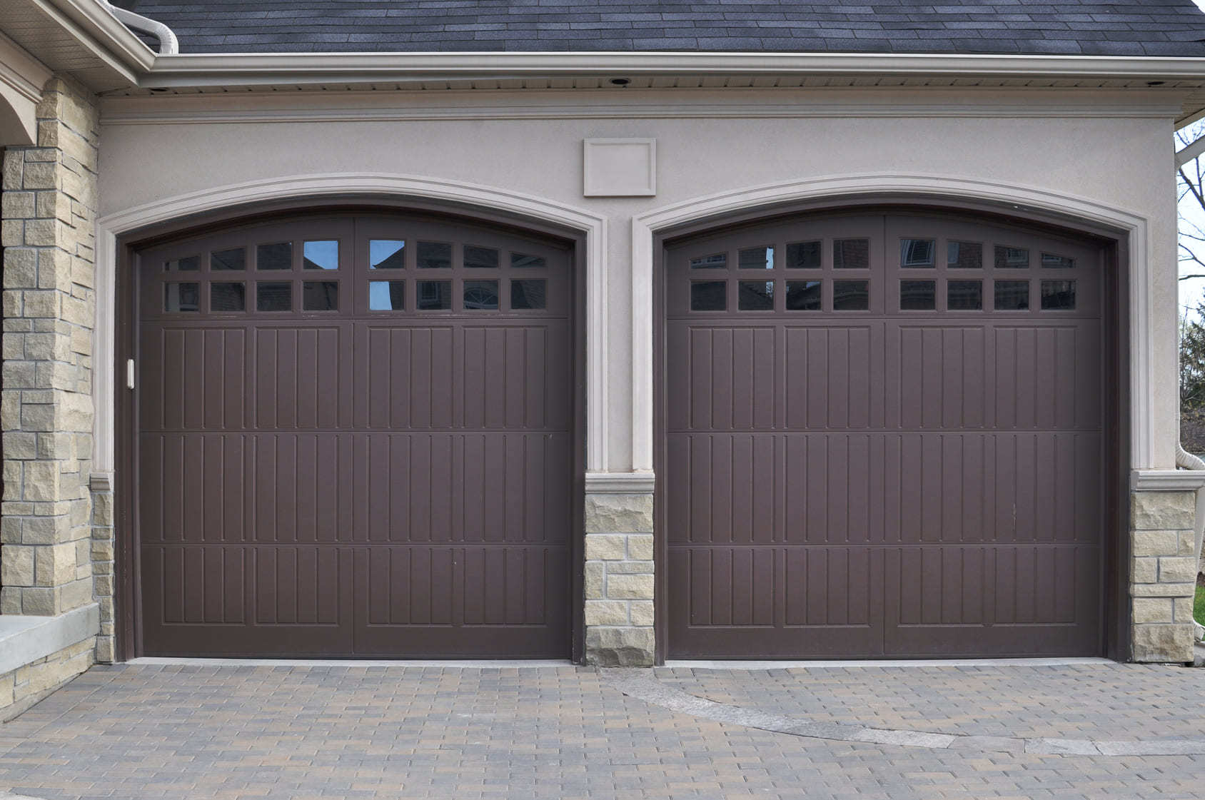 Double garage doors at a home typical of homes for sale in Ajax, Ontario
